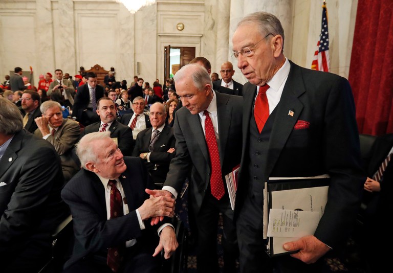 Attorney General-designate, Sen. Jeff Sessions, R-Ala., center, accompanied by Senate Judiciary Committee Chairman Sen. Charles Grassley, R-Iowa, right, reaches to shake hands with former Attorney General Edwin Meese III, as they arrive on Capitol Hill in Washington, Tuesday, Jan. 10, 2017, for Sessions confirmation hearing before the committee. (AP Photo/Alex Brandon)