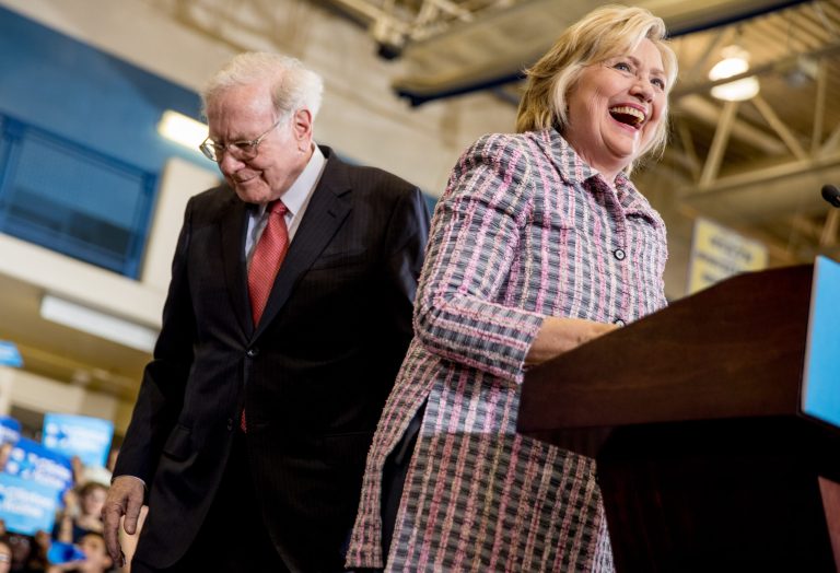 Democratic presidential candidate Hillary Clinton smiles as Berkshire Hathaway Chairman and CEO Warren Buffett introduces her at a rally at Omaha North High Magnet School in Omaha, Neb., Monday, Aug. 1, 2016. (AP Photo/Andrew Harnik)