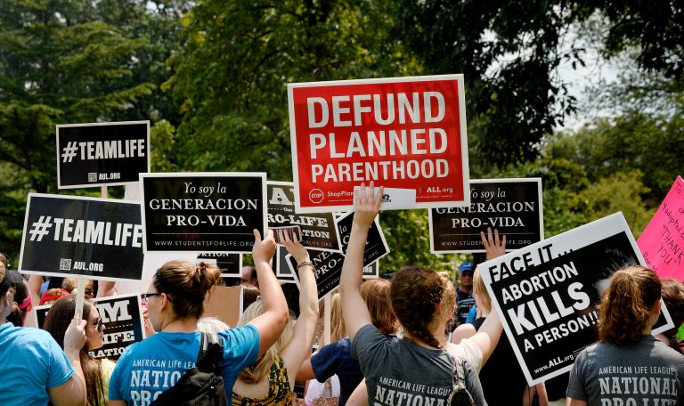 Anti-abortion activists hold a rally opposing federal funding for Planned Parenthood in front of the U.S. Capitol in Washington, DC. (Olivier Douliery/Getty Images)