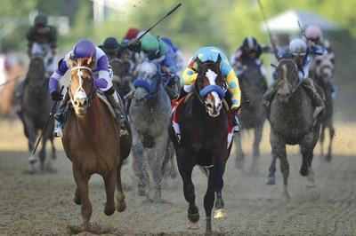 Patrick Smith/Getty Images
I'll Have Another, left, beat Bodemeister to win the 137th running of the Preakness Stakes at Pimlico Race Course on Saturday.