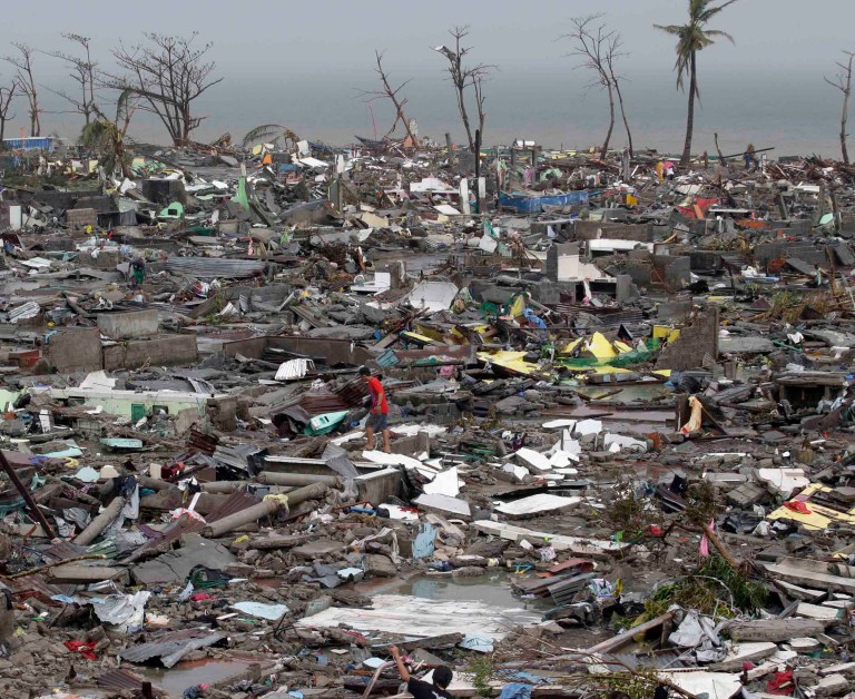 Destroyed houses lie in Tacloban city, Leyte province central Philippines on Sunday, Nov. 10, 2013. The city remains littered with debris from damaged homes as many complain of shortage of food, water and no electricity since the Typhoon Haiyan slammed into their province. Haiyan, one of the most powerful typhoons ever recorded, according to U.S. Navy's Joint Warning Center, slammed into central Philippine provinces Friday leaving a wide swath of destruction and scores of people dead.  (AP Photo/Bullit Marquez)