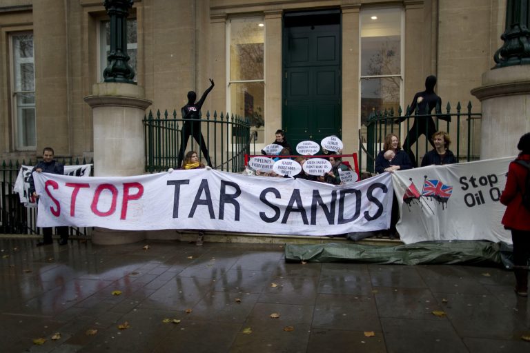 Environmental protesters against the tar sands industry attempt to blockade the annual Canada Europe Energy Summit with a performance-style demonstration outside Canada House by Trafalgar Square in London, Tuesday, Nov. 20, 2012. (AP Photo/Matt Dunham)