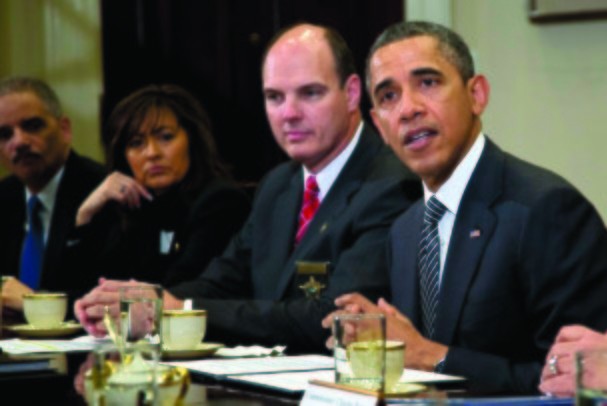 President Barack Obama meets with representatives from Major Cities Chiefs Association and Major County Sheriffs Association in the Roosevelt Room of the White House Monday to discuss policies put forward by President Obama to reduce gun violence. From left are U.S. Attorney General Eric Holder, Minneapolis Police Chief Janee Harteau and Hennepin County Minnesota Sheriff Richard W. Stanek. (AP Photo/Carolyn Kaster)