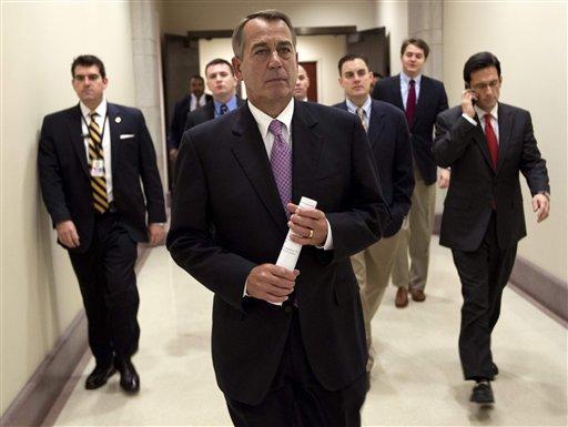 Speaker of the House Rep. John Boehner, R-Ohio, walks to a news conference on the payroll tax cut with House Majority Leader Rep. Eric Cantor, R-Va., right, on Capitol Hill on Thursday, Dec. 22, 2011 in Washington. 