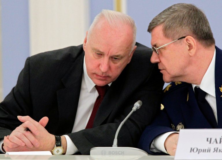  FILE In this Nov. 23, 2011 file photo, Alexander Bastrykin, head of the prosecutors' Investigative Committee, left, listens to Prosecutor General Yury Chaika, at a meeting in the Gorki residence outside Moscow. Dmitry Muratov, the editor of Novaya Gazeta where Anna Politkovskaya had worked before her 2006 murder, said Wednesday, June 13, 2012, in an open letter to Investigative Committee chief Alexander Bastrykin that he should offer security guarantees to reporter Sergei Sokolov. Muratov said that Bastrykin was angered by a Novaya Gazeta article that accused him of failing to punish the perpetrators of a 2010 killing of 12 people, including four children, by a gang in southern Russia. (AP Photo/RIA Novosti Kremlin, Mikhail Klimentyev, Presidential Press Service, file)  