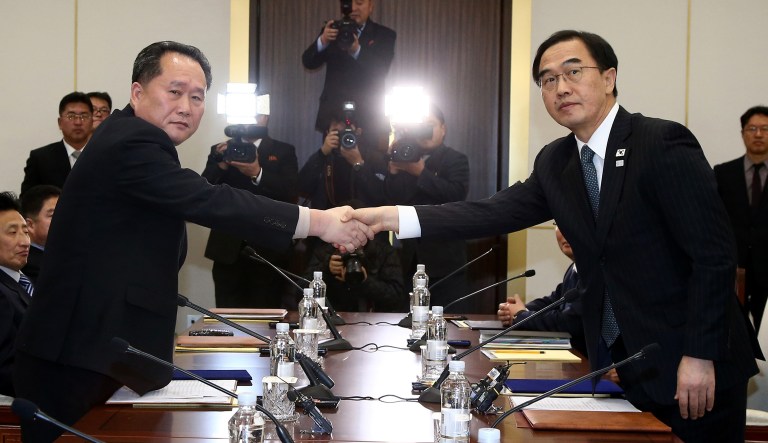 The rival Koreas took steps toward reducing their bitter animosity during rare talks Tuesday, as North Korea agreed to send a delegation to next month's Winter Olympics in South Korea and reopen a military hotline. (Korea Pool via AP)