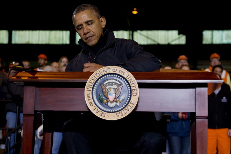 President Barack Obama signs a memorandum directing the Treasury Department to create a new retirement saving account after speaking at the U.S. Steel Irvin Plant, Wednesday, Jan. 29, 2014, in West Mifflin, Pa., about retirement policies he highlighted in the State of the Union address. (AP Photo/Carolyn Kaster)