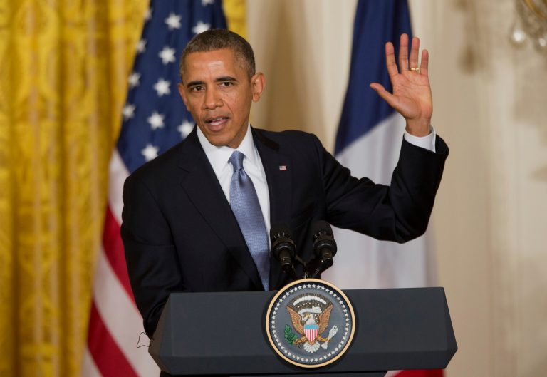 President Barack Obama gestures during a joint news conference with French President FranÃ§ois Hollande, as part of an official state visit, Tuesday, Feb. 11, 2014, in the East Room of the White House in Washington. (AP Photo/ J. Scott Applewhite)