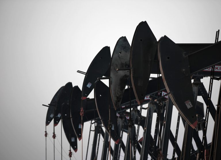 Oil pumps work in the desert oil fields of Sakhir, Bahrain. (AP/Hasan Jamali)