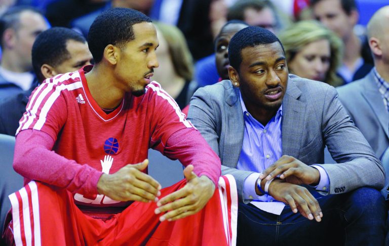 Rob Carr/Getty Images
Washington guards Shaun Livingston, left, and John Wall missed Monday's game. The Wizards expect Livingston back Wednesday, but there's no timetable for Wall's return.