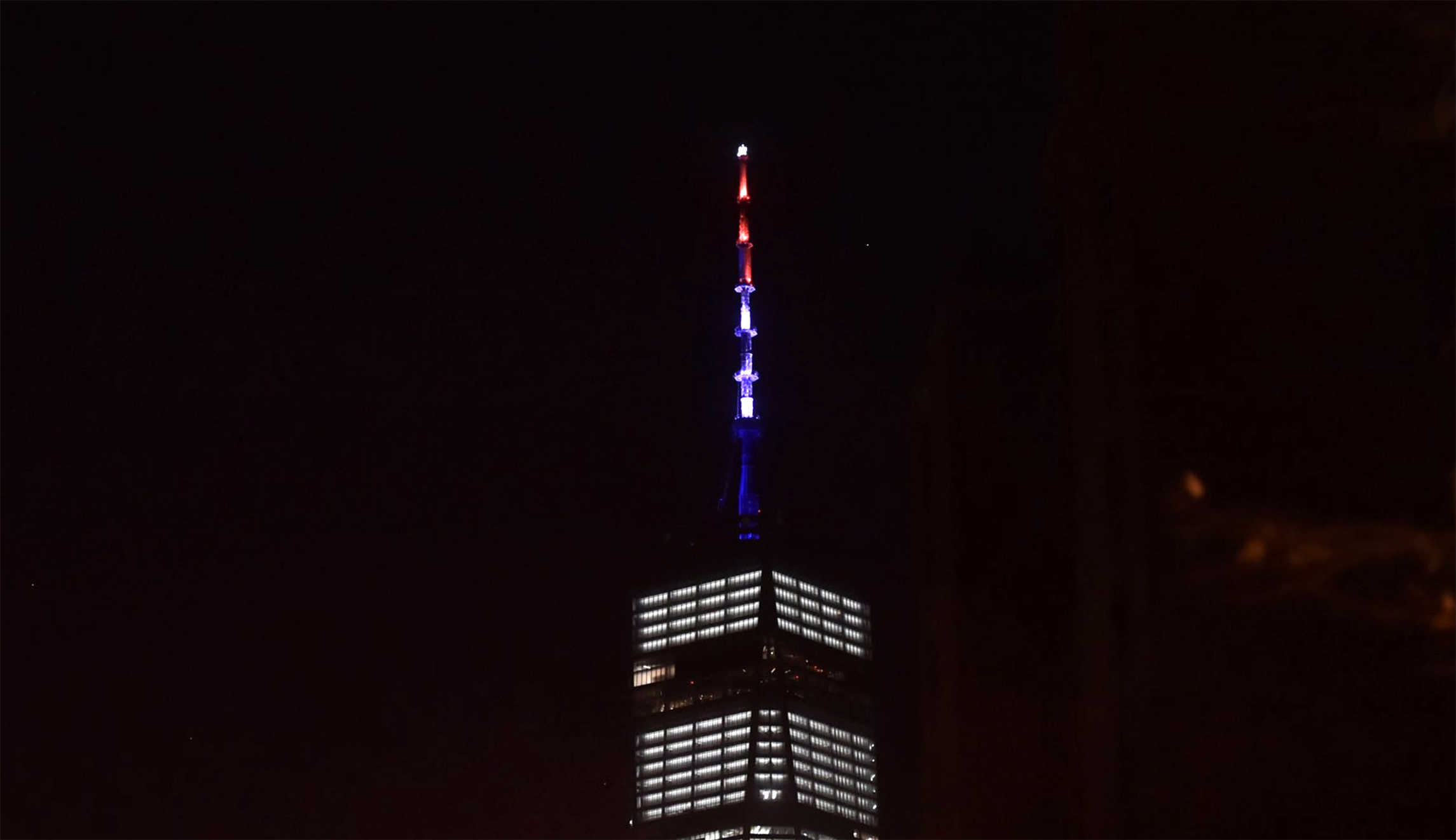 One World Trade Center lit up in red, white, and blue after deadly NYC truck attack