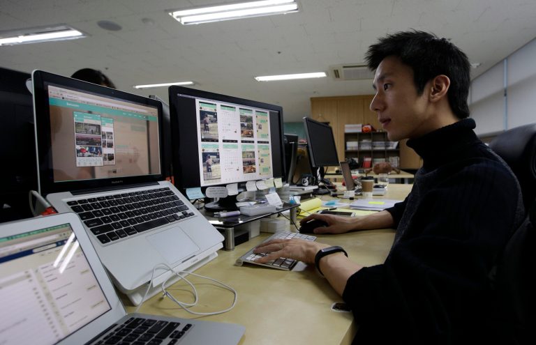 In this Monday, Jan. 20, 2014 photo, Value Creators & Company CEO Park Jaeuk shows his company's app Between on a screen at his office in Seoul, South Korea. Created by the Seoul-based startup, Between hit 5 million downloads in two years. About two thirds of the users are in South Korea with their average age in the mid-20s. Between has attracted more than half a million users in Japan and is expanding in Thailand and Singapore. Hundreds of thousands of Chinese and American couples have also joined. (AP Photo/Lee Jin-man)