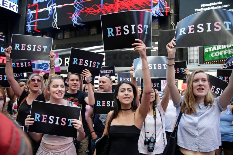 Protestors gather in Times Square, Wednesday, July 26, 2017, in New York. A rally was held in Times Square after President Donald Trump's announcement of a ban on transgender troops serving anywhere in the U.S. military. (AP Photo/Frank Franklin II)