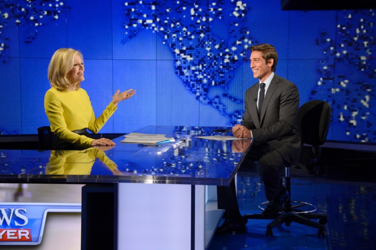 In this Wed., Aug. 27, 2014 photo provided by ABC, Diane Sawyer, left, signs off on her last broadcast as anchor of 