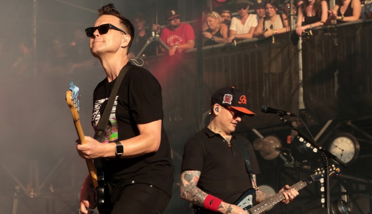 In this 2016 photo, Mark Hoppus, left, and Matt Skiba of the band Blink-182 perform on Day 4 of the 2016 Firefly Music Festival at The Woodlands in Dover, Del. After the mass shooting in Parkland, Fla., Hoppus tweeted Monday night he instructed his band's representatives to stop using FedEx shipping because of the company's ongoing relationship with the National Rifle Association. (Photo by Owen Sweeney/Invision/AP)