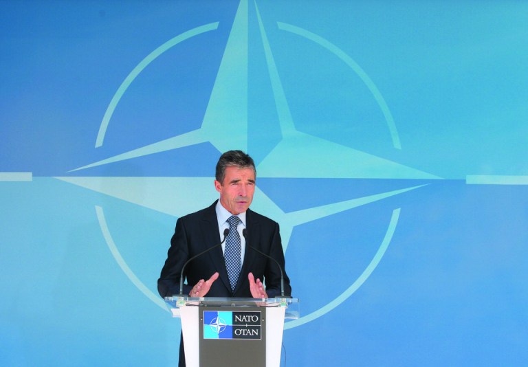 NATO Secretary General Anders Fogh Rasmussen addresses the media after he met with NATO ambassadors at NATO headquarters in Brussels, Tuesday, June 26, 2012. According to NATO, Syria's downing of a Turkish jet is 'unacceptable,' and NATO condemns 'it in the strongest terms'. (AP Photo/Yves Logghe)