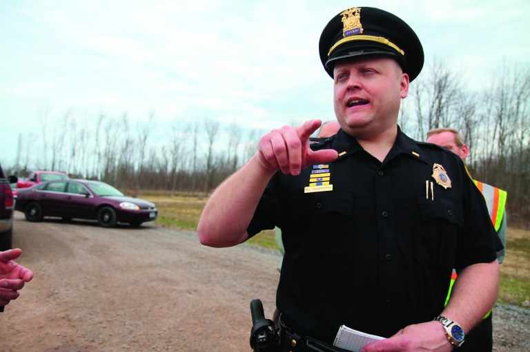 In this photo taken April 11, 2011, Lt. Michael Chiapperini with the Webster Police Department speaks to the media about the accidental death of a man working underground on the Monroe County Water Authority site in Webster, N.Y. on Lake Road near Basket Road. A former convict set a house and car ablaze in his lakeside New York state neighborhood to lure firefighters then opened fire on them, killing two, including Chiapperini, and engaging police in a shootout before killing himself while several homes burned. Authorities used an armored vehicle to evacuate the area. (AP Photo/Democrat & Chronicle, Tina Yee) MAGS OUT; NO SALES