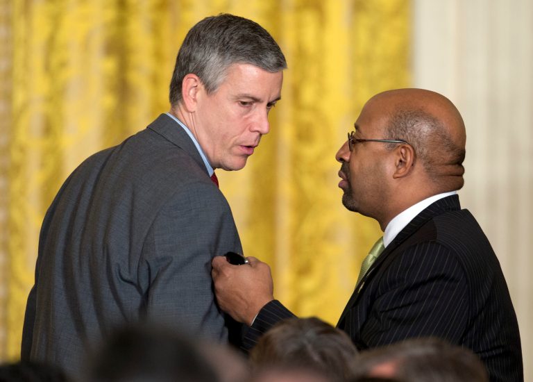 Education Secretary Arne Duncan, left, and Philadelphia Mayor Michael Nutter talk before President Barack Obama arrives to speak at a reception for the U.S. Conference of Mayors in the East Room of the White House, Thursday, Jan. 23, 2014, in Washington. (AP Photo/Carolyn Kaster)