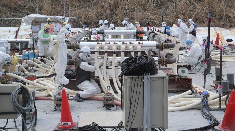 Workers build under ground frozen wall  by Tokyo Electric Power Co. (TEPCO) at the crippled Fukushima No. 1 power plant in Okuma, Fukushima Prefecture on Mar. 10, 2014, nearly three years after the plant was paralyzed by the March 11 earthquake and tsunami in 2011. (AP Photo/Koji Sasahara,pool)