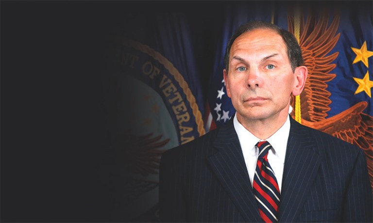 Robert McDonald, former Procter and Gamble executive and President Obama's nominee as the next Veterans Affairs secretary, listens at the Department of Veterans Affairs in Washington. (AP Photo/Charles Dharapak)