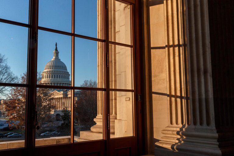 FILE - In this Wednesday, Dec. 18, 2013, file photo, the U.S. Capitol is shown in Washington. The U.S. government ran a $53.2 billion surplus in December, signaling further improvement in the nation's finances.  (AP Photo/J. Scott Applewhite)