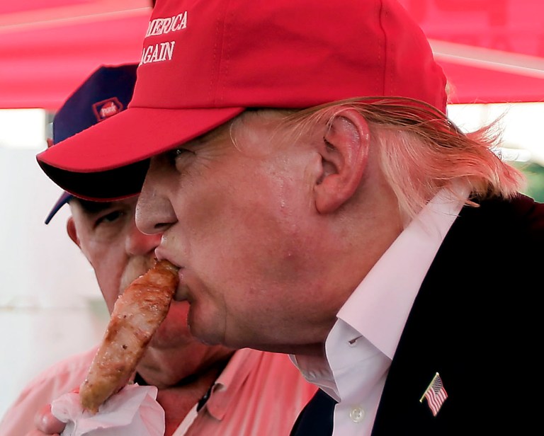 How many Thanksgiving dinners could the current presidential candidates, like Donald Trump, supply with the funds their campaigns have raised? (AP Photo/Charlie Riedel)