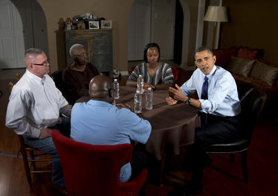 President Barack Obama gestures as he speaks to the media during a visit in Falls Church, Va., Thursday to meet with middle class taxpayers. Counter clockwise from the president are, high school teacher Tiffany Santana, her mother Velma Massenburg, Richard Santana, far left, who works at a local Toyota dealership, and Tiffany's father, Jimmy Massenburg. (AP Photo/Carolyn Kaster)