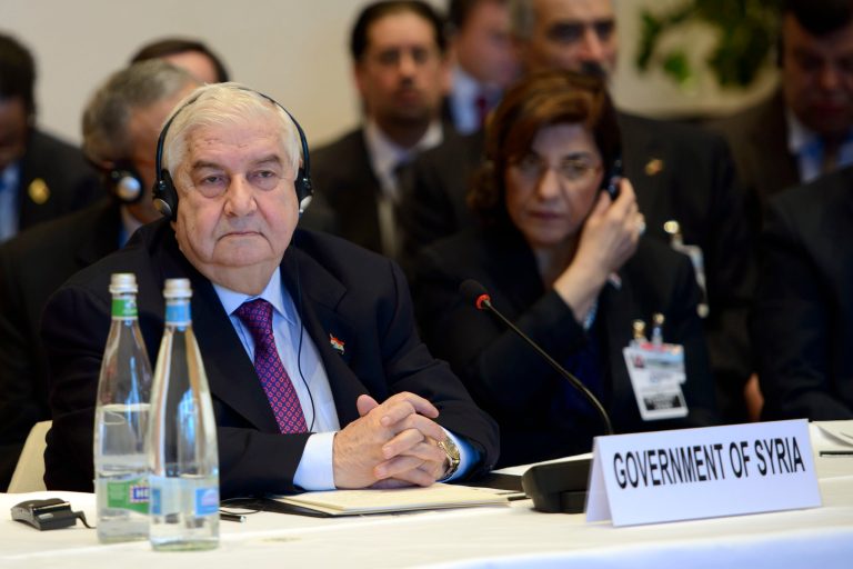 Syrian Foreign Minister Walid al-Mouallem, attends the  Geneva II peace talks on Syria  in Montreux Switzerland, Wednesday, Jan. 22, 2014. The Syrian peace talks begin with a bitter clash over President Bashar Assad's future. U.S. Secretary of State John Kerry says Assad's decision to meet peaceful dissent with brutal force had robbed him of all legitimacy, while Assad's foreign minister declared that no one outside Syria had the right to remove the government.  (AP Photo/Keystone,Martial Trezzini)