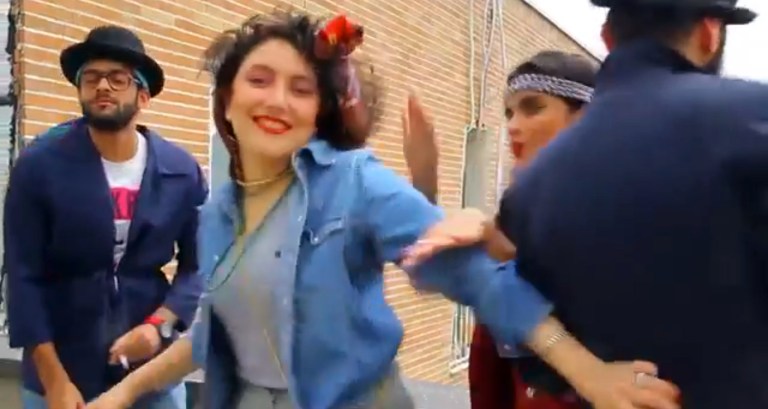 FILE - In this frame grab taken from video posted to YouTube, people dance to Pharrell Williams' hit song 