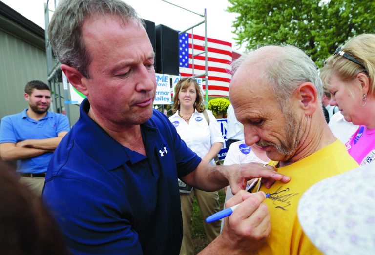 Maryland Gov. Martin O'Malley, left, signs an autograph for Terry Stewart, of Dubuqe, Iowa, after speaking at U.S. Sen. Tom Harkin's annual fundraising steak fry, Sunday, Sept. 16, 2012, in Indianola, Iowa. O'Malley, chairman of the Democratic Governors Association, is walking an early -- and tricky path -- into presidential proving ground Iowa on Sunday, less than 60 days before the 2012 election. (AP Photo/Charlie Neibergall)