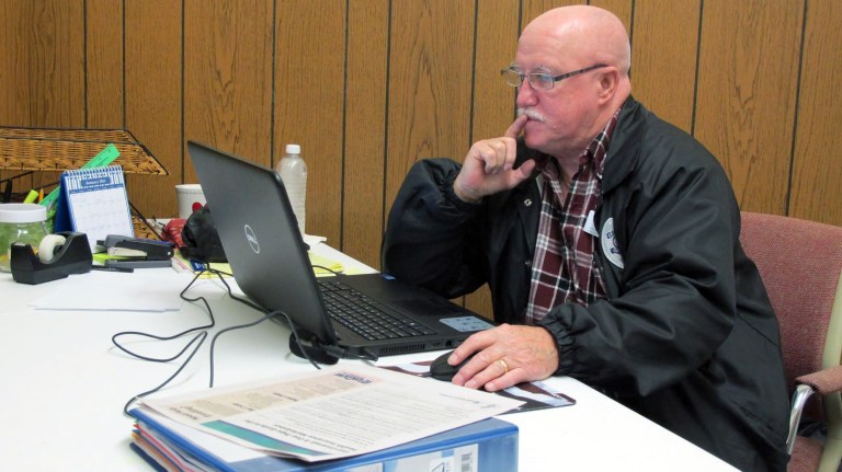 Joe Manning, shown here Dec. 17, is an outreach worker trained to sign up people in rural Florida to participate in the Affordable Care Act. (AP Photo/Melissa Nelson)