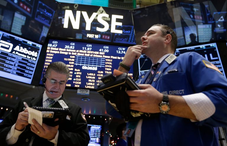   In this Wednesday, Dec. 26, 2012, photo, Daniel Kryger, left, and Kevin Lodewick Jr., right, work on the floor of the New York Stock Exchange in New York. Stocks are edging higher on Thursday as hopes dim that a budget deal will be reached before a deadline at the end of the year. (AP Photo/Kathy Willens)  