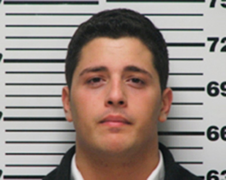 This undated photo provided by the Highland Police Department in Highland, Ill., shows Ramsey Fakhouri, of Troy, Mich. Fakhouri was sentencedFriday, July 11, 2014, at federal court in East St. Louis, Ill., to six and a half years in prison for helping carry out a robbery outside a bank in Highland where his girlfriend worked. Authorities say Fakhouri took part in the Feb. 14 holdup of nearly $26,000 from a Bradford National Bank.  His 18-year-old co-defendant from Concord, Michigan, awaits trial. (AP Photo/Courtesy of the Highland Police Department)