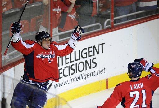Washington Capitals left wing Alex Ovechkin, left, of Russia, celebrates his goal with teammate Brooks Laich (21) during the first period of an NHL hockey game against the Buffalo Sabres, Friday, Dec. 30, 2011, in Washington. (AP Photo/Nick Wass)