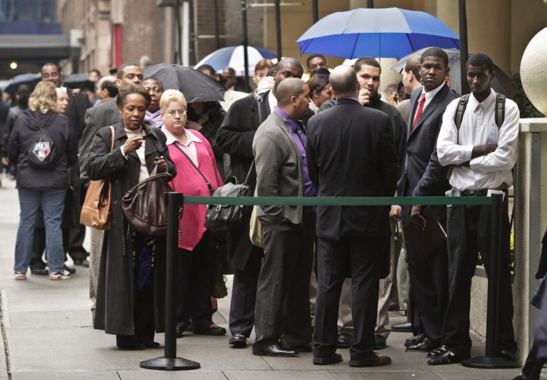 Job seekers wait in line to see employers at the National Career Fairs' job fair in New York. (AP Photo)
