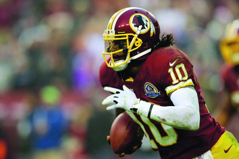 Alex Brandon/AP
Rookie quarterback Robert Griffin III sprained a ligament in his right knee two weeks ago against the Ravens and missed the Redskins' victory over the Browns on Sunday.