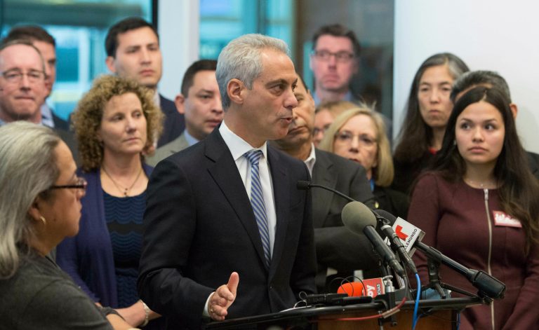Chicago Mayor Rahm Emanuel, center, speaks at a news conference Monday, Nov. 14, 2016, in Chicago. Emanuel said the outcome of the U.S. presidential election will not impact Chicago's commitment as a sanctuary city for immigrants. (AP Photo/Teresa Crawford)