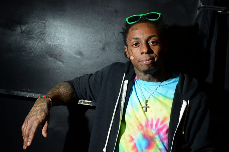 FILE - In this Feb. 1, 2013 file photo, recording artist Lil Wayne meets fans and celebrates his contemporary street wear apparel brand TRUKFIT at his hometown Macy's, in New Orleans. A letter from Lil Wayne to the offended family of Emmett Till did not go far enough and relatives of the late civil rights icon are seeking a meeting with the rapper and representatives from PepsiCo to discuss their commercial partnership. The New Orleans rapper made the brief offensive reference to Till on Future's song 