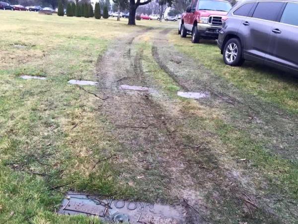 Supporters, protesters park on top of graves at Trump rally