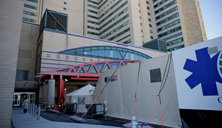 In this photo from Monday, a mobile emergency room is set up outside Grady Memorial Hospital in Atlanta. The annual analysis released Wednesday by the nonpartisan Office of the Actuary within the Centers for Medicare and Medicaid Services projects that healthcare spending will grow by an average of 5.5 percent each year during the period up to 2026, reaching $5.7 trillion. (AP Photo/David Goldman)