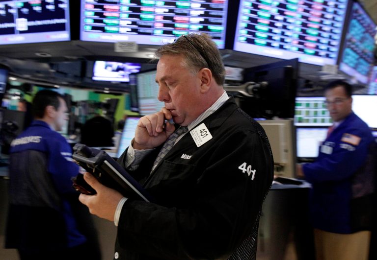   FILE - In this Monday, June 11, 2012, file photo, Trader Michael Iervoline works on the floor of the New York Stock Exchange. Wall Street appeared headed for a choppy session Thursday June 14, 2012, with futures swinging between gains and losses. Dow Jones industrial futures was nearly flat at 12,423 while and S&P 500 futures were nearly unchanged at 1,308.40. (AP Photo/Richard Drew, File)  