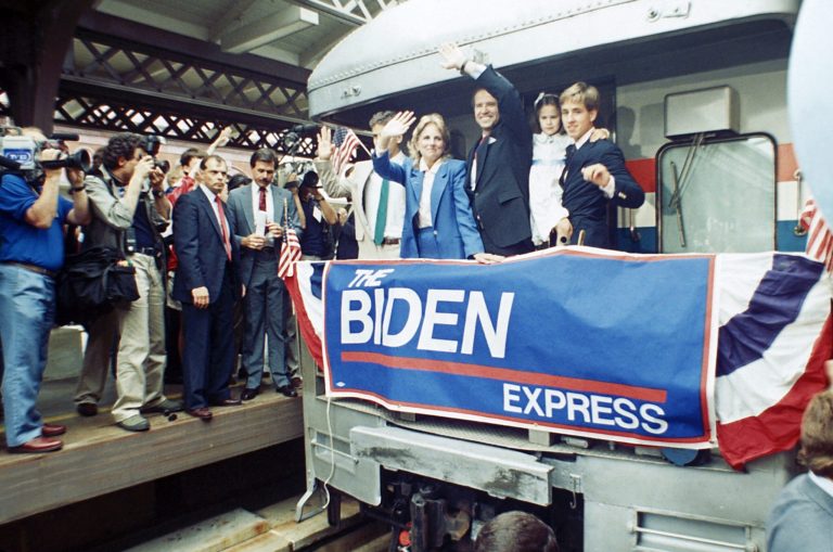 In this June 9, 1987 file photo, Sen. Joe Biden, D-Del., waves from his train as he leaves Wilmington, Del., after announcing his candidacy for president. (AP Photo/George Widman)