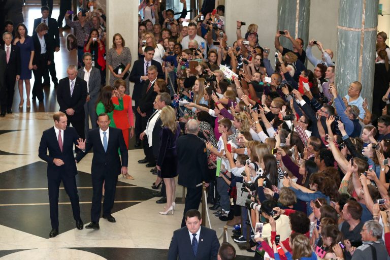 Britain's Prince William, center left,  is accompanied by Prime Minister Tony Abbott, center right, as they arrive for a reception Thursday, April 24, 2014, at Parliament House in Canberra, Australia. (AP Photo/Alex Ellinghausen, Pool)