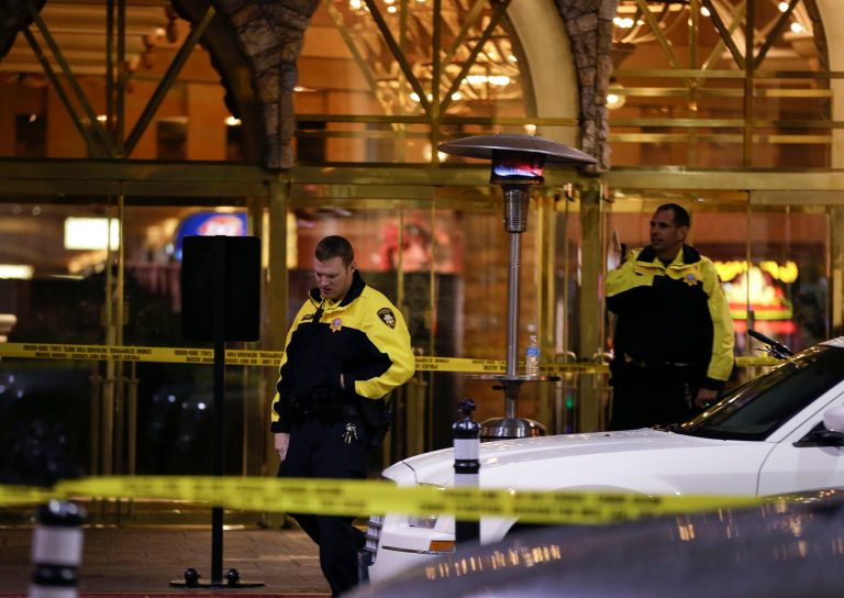  Las Vegas Metro Police officers stand watch outside the entrance to the Excalibur hotel-casino after a shooting near the registration desk left two dead, Friday, Dec. 14, 2012, in Las Vegas. At around 8:30 p.m., a man shot a woman, who was a vendor at the hotel's concierge desk, and then turned the gun on himself. The man was found dead at the scene. The woman was transported to a local hospital, where she was pronounced dead.(AP Photo/Julie Jacobson)  