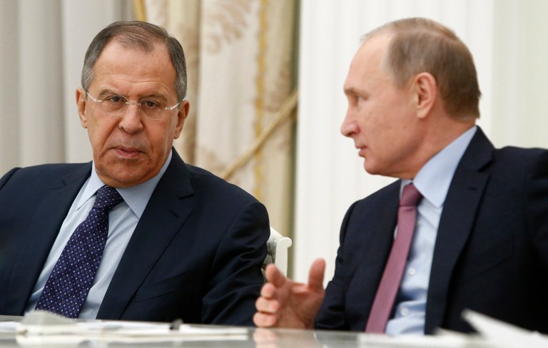 Russian Foreign Minister Sergey Lavrov tells President Vladimir Putin to strike back at President Obama's move to expel 35 Russian diplomats by removing 35 American diplomats. (Sergei Karpukhin/Pool Photo via AP)