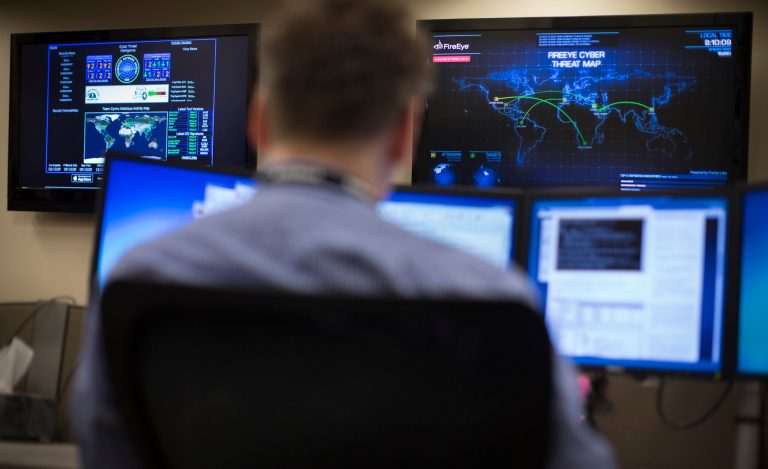 The grid that manages the electric distribution grid in towns, cities and neighborhoods is being targeted more often. (AP Photo/John Minchillo)