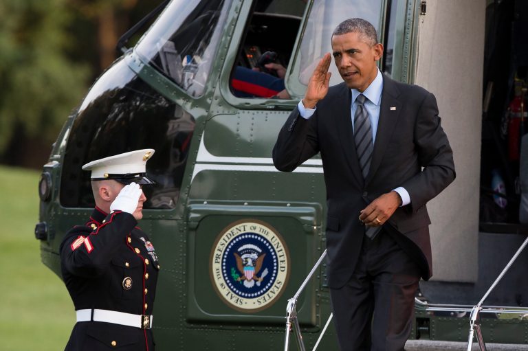President Barack Obama salutes as he arrives on the South Lawn of the White House, on Friday, Sept. 12, 2014, in Washington. (AP Photo/Evan Vucci)