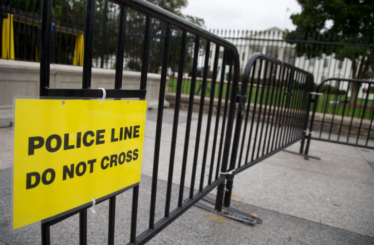 In this Oct. 3, 2014, file photo, a temporary barrier marked with a sign 