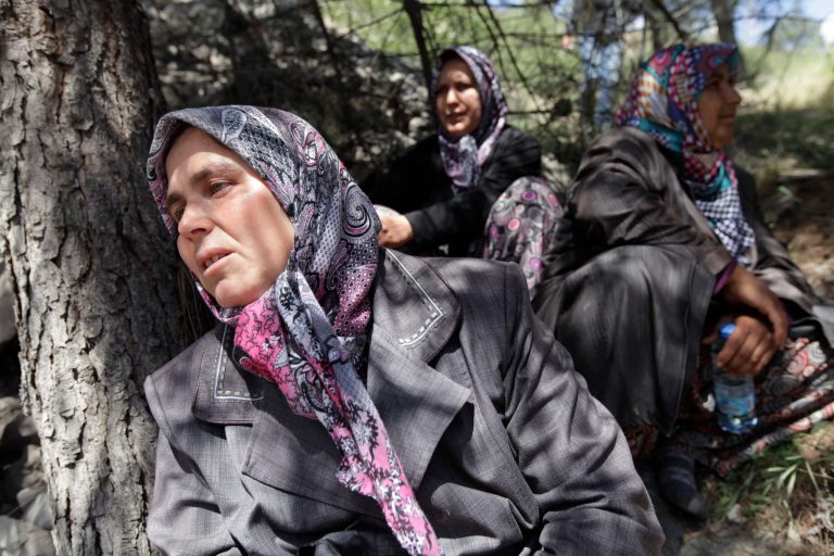 Relatives of miners wait near a coal mine in Soma, western Turkey, Thursday, May 15, 2014. An explosion and fire at the coal mine in Soma, some 250 kilometers (155 miles) south of Istanbul, killed hundreds of workers, authorities said, in one of the worst mining disasters in Turkish history. (AP Photo/Lefteris Pitarakis)