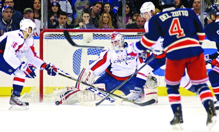 Kathy Willens/AP
Washington goalie Braden Holtby made 38 saves in the Capitals' 2-1 loss to the Rangers on Sunday.